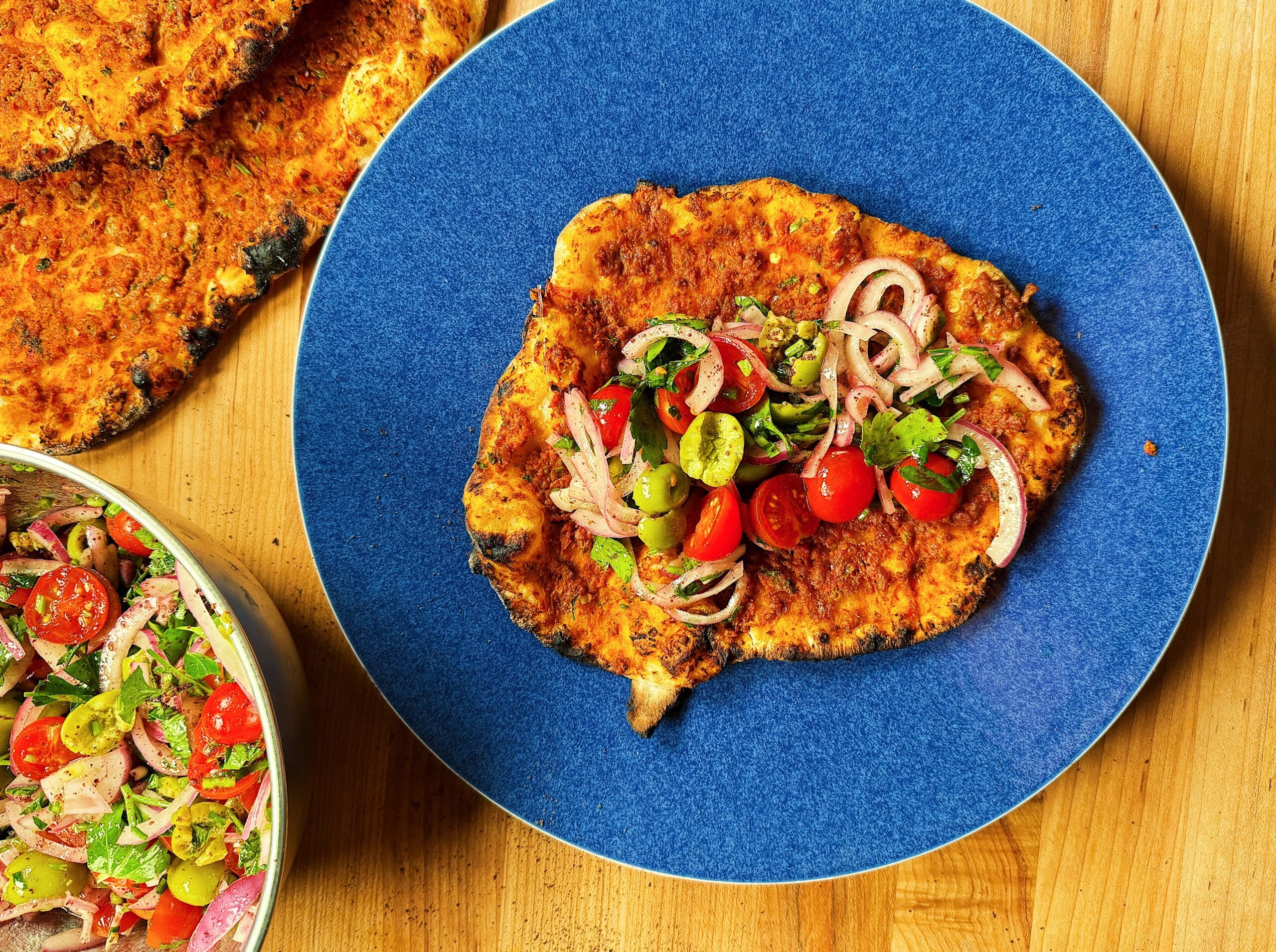 Easy Lahmacun With Spiced Ground Lamb and Lemony Olive Salad